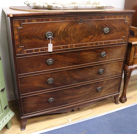 A Regency banded and line inlaid mahogany secretaire chest, with a satinwood lined interior W.119cm